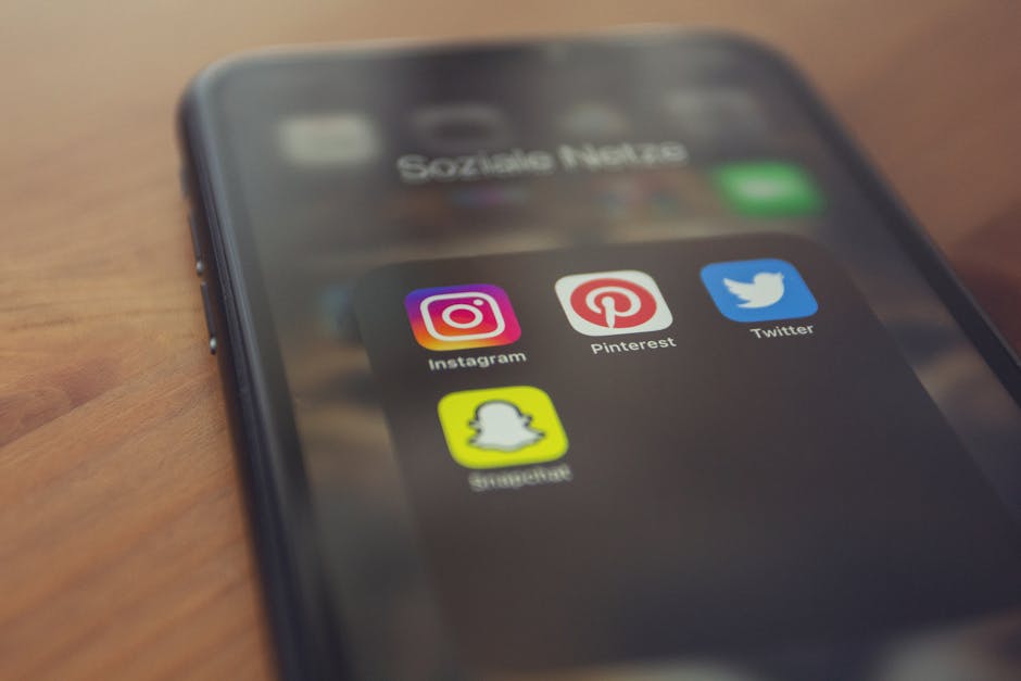 pexels-photo-7634159-7634159 Smartphone displaying popular social media apps like Instagram, Pinterest, Twitter, and Snapchat.